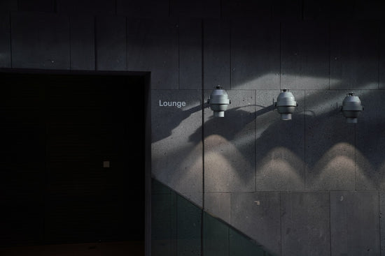 Minimalist interior featuring clean lines and wall art lighting, evoking the Modern Shan Shui aesthetic